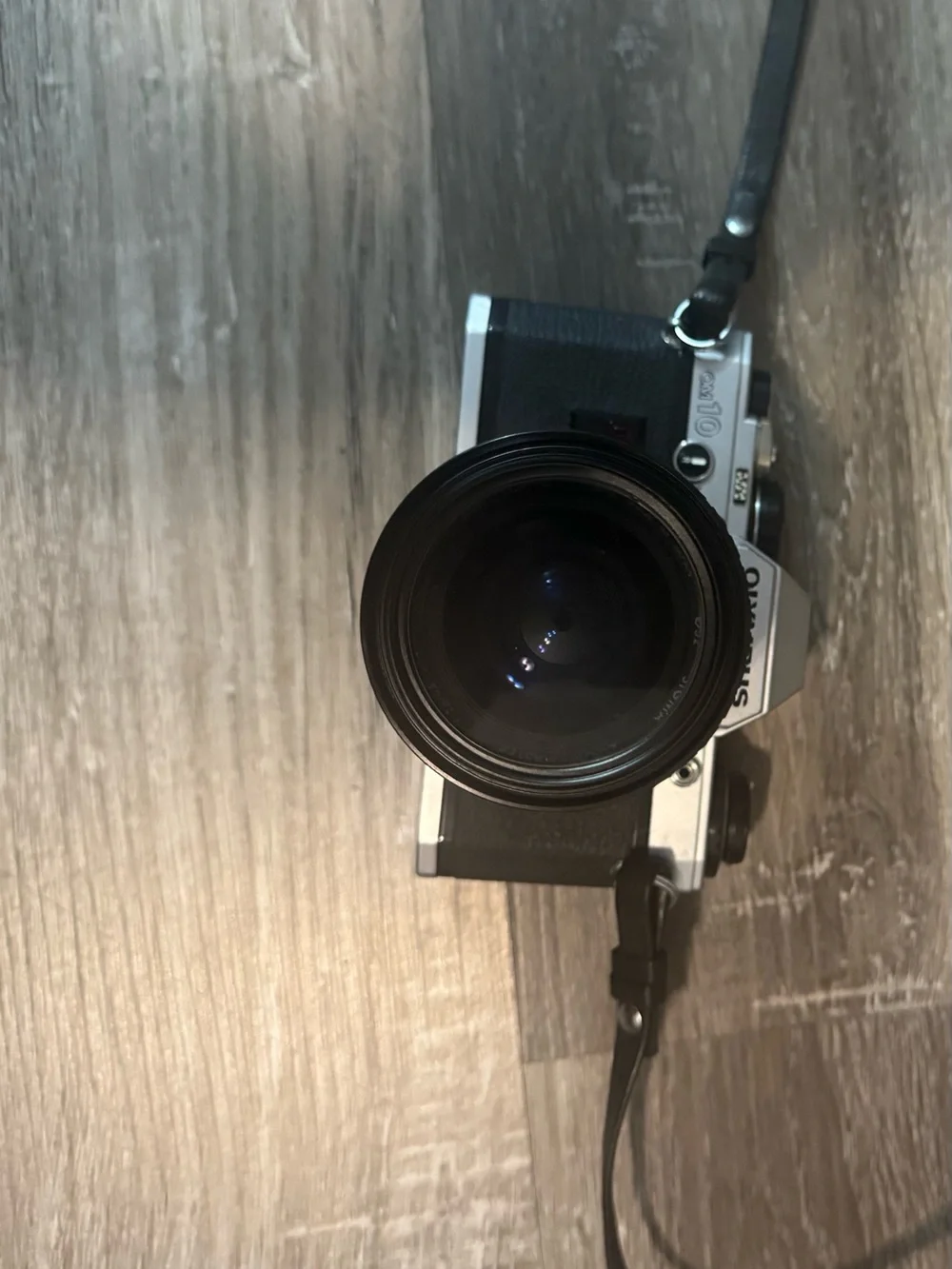 Olympus OM-10 35mm SLR Camera in Silver and Black with Telephoto Lens